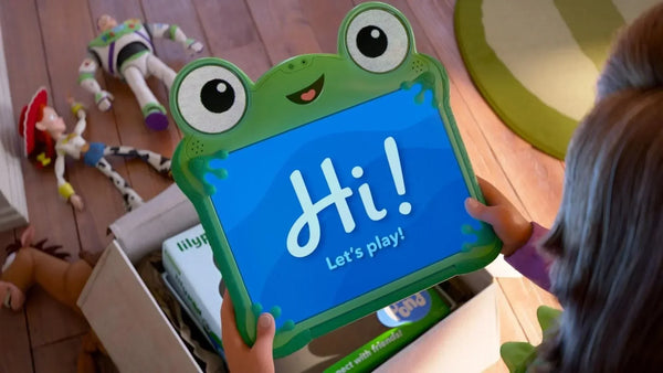 Concept art of the Toy Story 5 tablet showing its green frog-themed design with soft rubber corners and a bright screen displaying animated eyes.
