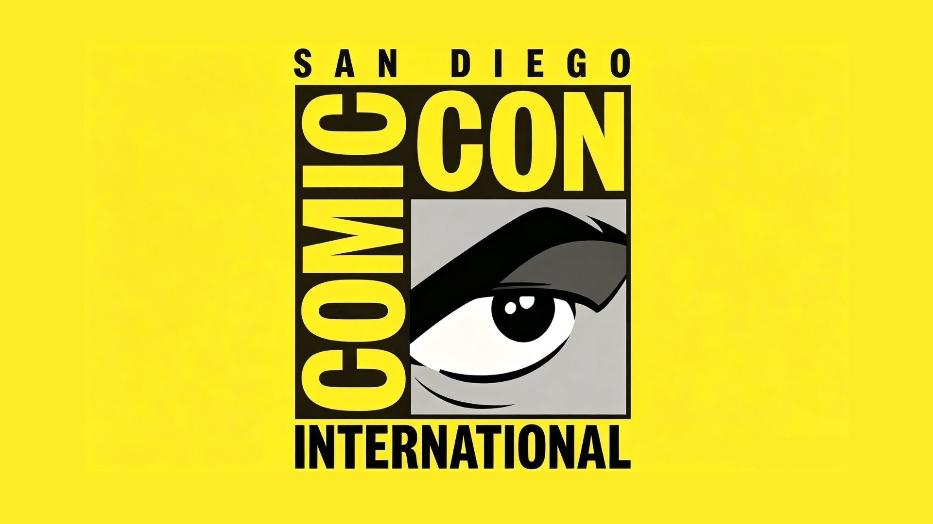 Official San Diego Comic-Con International logo on solid bright yellow background, bold comic-style typography with iconic cartoon eye graphic inside square frame