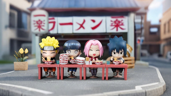 Nendoroid figures of Naruto, Hinata, Sakura and Sasuke eating ramen outside Ichiraku Ramen Shop miniature street scene, cute Naruto anime diorama