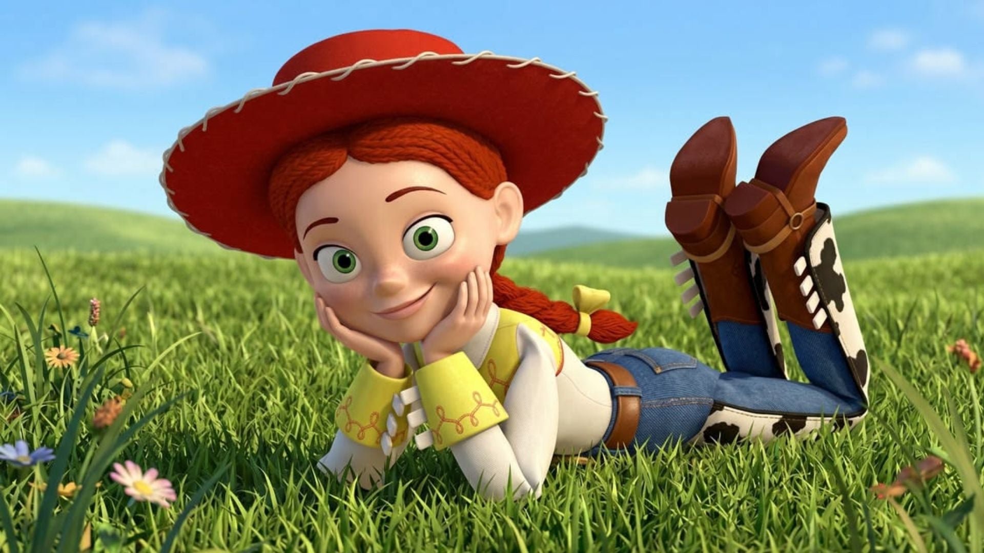 Jessie the cowgirl from Toy Story lying on lush green grass with chin in hands, red cowboy hat, countryside meadow background under bright blue sky