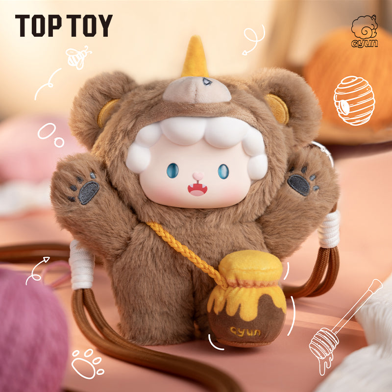 Plush toy bear in a lion costume holding a honey pot with 'TOPTOY' branding.